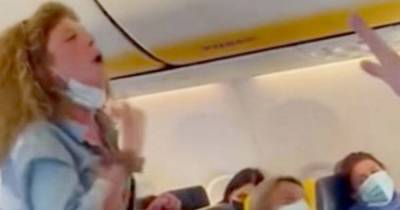 Ryanair passenger attacks woman on flight in row over face coverings before being dragged off - www.dailyrecord.co.uk - Spain - Italy