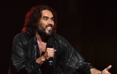Russell Brand announces ‘The 33 Tour’ across the UK this summer - www.nme.com - Britain