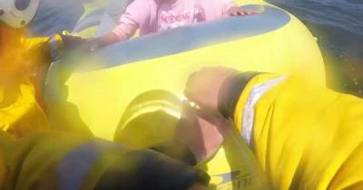 Moment terrified little girl is rescued after being swept out to sea on inflatable in north Wales - www.manchestereveningnews.co.uk