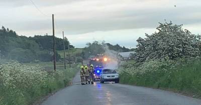 Fire crews race to car blaze on Scots road after ‘flames and smoke’ burst out from dashboard - www.dailyrecord.co.uk - Scotland