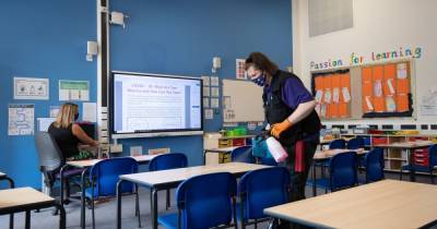 Hundreds of pupils isolating just days into new term amid positive Covid cases in schools - www.manchestereveningnews.co.uk - Manchester