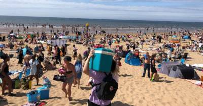 'Who needs holidays abroad...' crowds flock to Formby Beach to soak up sun on hottest day of the year - www.manchestereveningnews.co.uk - Manchester