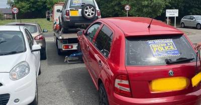 Nine cars seized as drivers caught not wearing seatbelts and using phones in police crackdown - www.manchestereveningnews.co.uk - Manchester