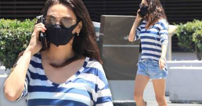 Mila Kunis shows off her legs in jean shorts while running errands - www.msn.com - Beverly Hills
