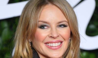 Kylie Minogue is stunning in black swimsuit as she holidays in 'paradise' - hellomagazine.com