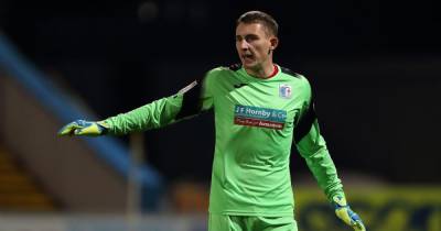 Who is Joel Dixon? The Barrow goalkeeper linked with transfer to Bolton Wanderers - www.manchestereveningnews.co.uk - city Swansea - county Newport