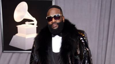 Rick Ross Shares That He Saves Money by Cutting His Own Grass and Flying Commercial - www.etonline.com