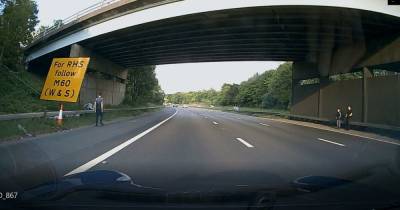 Video shows kids by side of M61 before they 'run across' the carriageway - www.manchestereveningnews.co.uk