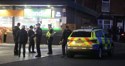 Armed police descend on petrol station after machete-wielding gang attack three men - www.manchestereveningnews.co.uk