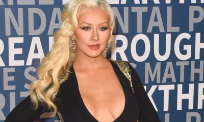 Christina Aguilera is a vision in high-cut white bodysuit - hellomagazine.com