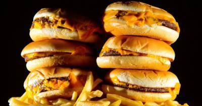 Junk food ads will be banned on TV before 9pm with tougher online restrictions - www.manchestereveningnews.co.uk - Britain