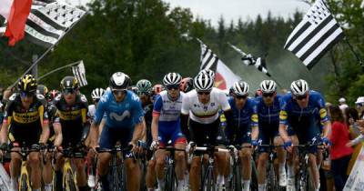 Tour de France crash: Spectator with sign for TV cameras causes huge pile-up on first day of race - www.msn.com - France