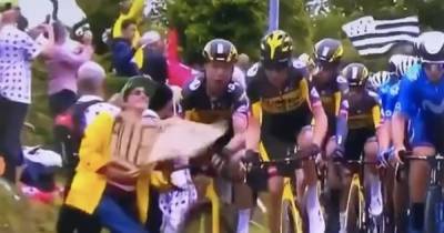 Moment fan causes horrific cycling crash at Tour de France leaving multiple riders injured - www.manchestereveningnews.co.uk - France