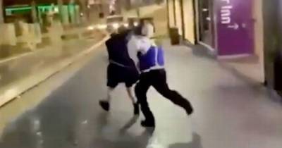 Police probe after video allegedly shows guard at McDonald's beating woman in street - www.dailyrecord.co.uk