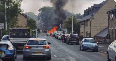 Police hunting driver who fled burning car after crashing into Range Rover - www.manchestereveningnews.co.uk