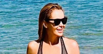 Amanda Holden sizzles in daring fishnet swimsuit while on Portugal holiday - www.ok.co.uk - Portugal