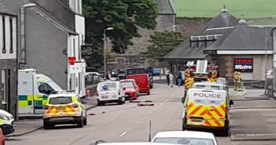 Police lock down Scots street after racing to 'disturbance' as man arrested - www.dailyrecord.co.uk - Scotland