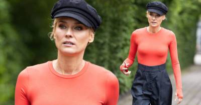 Diane Kruger puts on a chic display in an orange top and baker boy hat - www.msn.com - Germany
