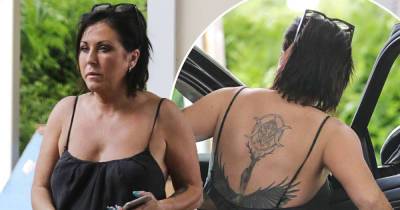 EastEnders star Jessie Wallace shows off her intricate back tattoo - www.msn.com