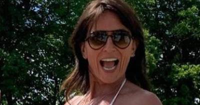 Davina McCall, 53, demands attention in white bikini as she shows off her enviable curves - www.ok.co.uk
