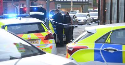 Man arrested on suspicion of attempted murder after man 'stabbed' in neck and found in the street by police officer - www.manchestereveningnews.co.uk - Manchester