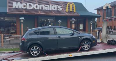 Police seize vehicle at McDonald's drive-thru after driver found to have no insurance - www.manchestereveningnews.co.uk