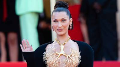 Bella Hadid Stuns In Golden Lung Necklace at 2021 Cannes Film Festival - www.etonline.com - city Golden