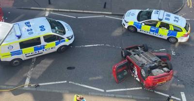 One person rushed to hospital after motor flips onto roof in horror Edinburgh crash - www.dailyrecord.co.uk