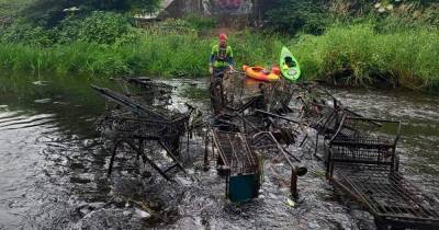 Outrage as clean-up kayakers pull 14 trolleys from river at Scots beauty spot - www.dailyrecord.co.uk - Scotland