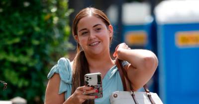 Jacqueline Jossa beams as she runs errands in summery blue top and jeans - www.ok.co.uk