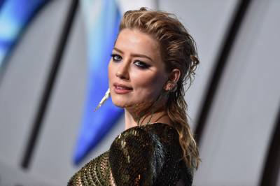 Amber Heard Says She’s ‘Mom And Dad’ To Baby Daughter Oonagh Paige, Shares Adorable Photo - etcanada.com