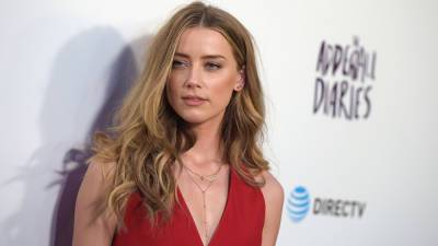 Amber Heard makes it clear she's 'the mom and the dad' in post featuring her baby girl - www.foxnews.com
