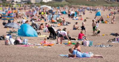 Hundreds flock to Scots beaches for summer fun as temperatures soar - www.dailyrecord.co.uk - Scotland