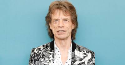Mick Jagger, 77, poses for rare photo with four year old son Deveraux and partner Melanie - www.ok.co.uk
