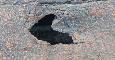 Busy Manchester city centre street closed off after sinkhole appears in road - www.manchestereveningnews.co.uk - Manchester
