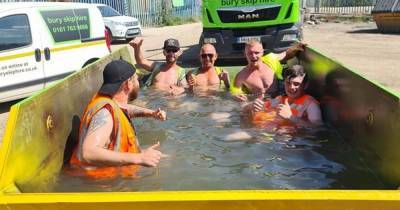 Staff at Bury skip hire company cool down by turning skip into swimming pool - www.manchestereveningnews.co.uk - Manchester