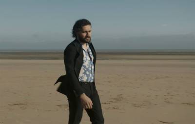 Watch Gang Of Youths perform on the beach in ‘Unison’ music video - www.nme.com
