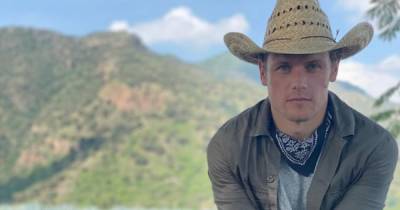 Sam Heughan saddles up with cowboy hat as fans speculate new booze line - www.dailyrecord.co.uk