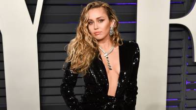 Miley Cyrus poses on dad Billy Ray's truck in NSFW shirt, heels: Don’t know which he’ll 'be more pissed about' - www.foxnews.com