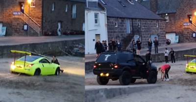 Comedy gold as flash car gets stuck in sand at Scots beach - www.dailyrecord.co.uk - Scotland
