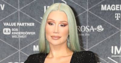 Iggy Azalea vows to stop sharing images of her son after clothing criticism - www.wonderwall.com