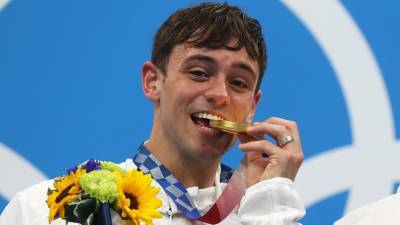 Tom Daley Proud to Be 'a Gay Man and Also an Olympic Champion’ After Earning First Gold Medal - www.etonline.com - Japan