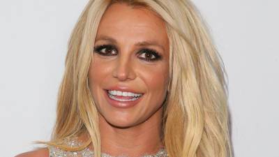Britney Spears reposts topless photo wearing only denim shorts ahead of another court hearing - www.foxnews.com