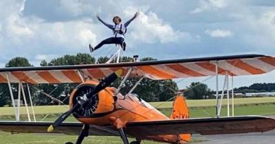Wingwalking Scots mum with incurable Huntington’s disease on cloud nine after high-flying stunt - www.dailyrecord.co.uk - Britain - Scotland