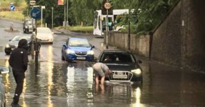 Flash floods cause chaos for Glasgow and Edinburgh drivers after heavy downpour - www.dailyrecord.co.uk