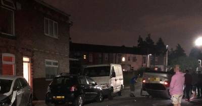 Gang in 'stolen car' leave trail of damage after flipping over on Salford street - www.manchestereveningnews.co.uk - Manchester - city This