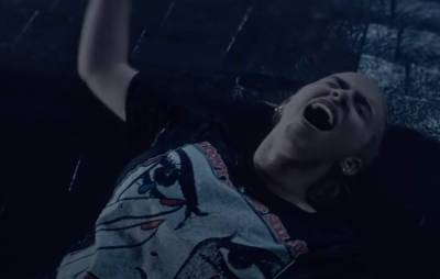 Billie Eilish fights a literal flood of emotion in striking new video for ‘Happier Than Ever’ - www.nme.com