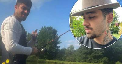 Zayn Malik returns to social media with a rare selfie and fishing snap - www.msn.com