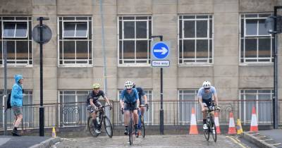 Athletes overcome downpours and gruelling feats to take on Ironman UK in Bolton - www.manchestereveningnews.co.uk - Britain