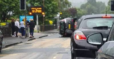 Motor flips onto side after horror crash in Edinburgh as flash flooding wreaks chaos on roads - www.dailyrecord.co.uk